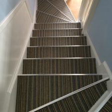 View down stairs fitted with wool loop carpet by Edel Telenzo from their Barbican range