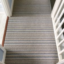 View of landing fitted with striped wool loop carpet over Cloud 9 Cirrus underlay.