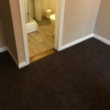 Tweed carpet in a printed nylon design fitted to a hotel bedroom over Cloud 9 contract underlay.