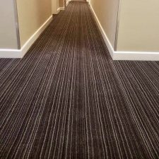 View of a hotel hall fitted with striped Lano Carpets flooring in a printed nylon design