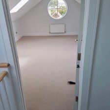 Beige carpet fitted in a bedroom of a beach house with Duralay King underlay.