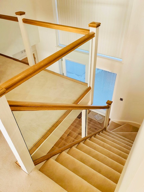 Ivory wool carpet fitted on stairs and landing over Elegance high density PU foam underlay