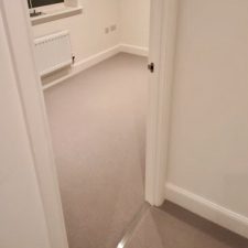 View of a bedroom fitted with light grey 100% pure wool New Zealand wool loop pile carpet fitted over Tredaire softwalk PU foam overlay