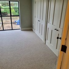 Wool loop carpet from the Rya range in Pumice by Edel Telenzo Carpets fitted in a bedroom.