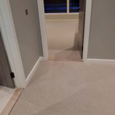 Beige marble colour carpet by Edel Telenzo Carpets fitted on a landing and bedroom in a modern renovation in East Wittering