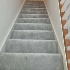 View of staircase fitted with with grey luxelle saxony twist polypropylene carpet.