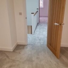 View of bedroom and landing with grey luxelle saxony twist polypropylene carpet