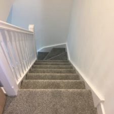 View down stairs fitted with grey excellon polypropylene carpet by Sargeant Carpets