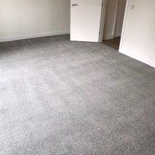 Bedroom carpet in grey which is made from Excellon Polypropylene, a twist pile carpet fitted over Tredaire softwalk pu foam underlay by Sargeant Carpets.