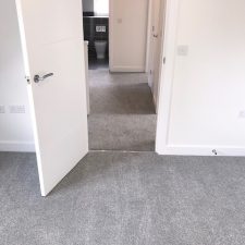 Bedroom fitted with a grey, Holywell Tin coloured carpet by Cormar Carpet Company.