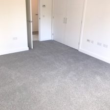 Bedroom fitted with a grey, Holywell Tin coloured carpet by Cormar Carpet Company. Made from Excellon Polypropylene, a twist pile carpet.