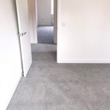 Bedroom fitted with a grey, Holywell Tin coloured carpet by Cormar Carpet Company.
