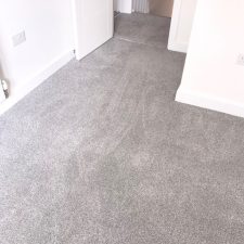 Bedroom fitted with a grey, Holywell Tin coloured twist pile carpet.