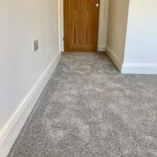 View of hallyway fitted with grey carpet by Cormar Carpet Company