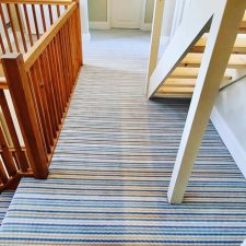 View of blue, white and beige stripy landing carpet by Adam Carpets' Panache range in Zing colour (code PN03)Adam-Carpets-Panache-range-Zing-PN03)