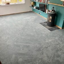 view of a living room with grey Associated Weavers carpet from their Vivendi range in Verve quality, Jurassic colourway.