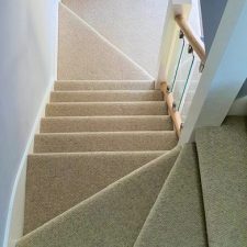 View down a staircase fitted with a beige Cormar Carpet from the Malabar range in Llama
