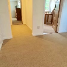 View of landing with a beige carpet by Ulster Carpets from their Grange Wilton range in Spelt.