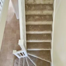 View of stair treads fitted with a beige carpet from the Sensations range by Cormar Carpets in alpine stone