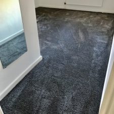 View into a bedroom fitted with a dark grey Super Soft iSense polyamide Saxony carpet.
