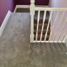 View down stairs from a landing fitted with Solution dyed Ivivo nylon Saxony, Easy clean bleach cleanable, heavy duty Heather effect pile carpet.