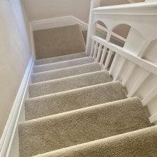 View down a flight of stairs fitted with Polypropylene twist pile, Easy clean bleach cleanable pile, heavy domestic quality