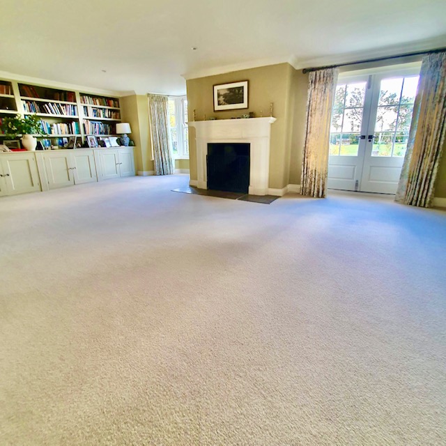 View of a large living room fitted with High quality wool loop pile, moth proofed yarn.