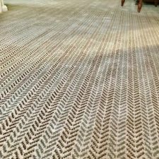 View of a carpet in a herringbone pattern