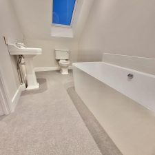 View of a bathroom loft room fitted with pale grey 80% wool 20% nylon twist carpet with 2 x ply yarn, moth proofed wool yarn with very heavy domestic rating.