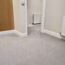 View of a landing fitted with pale grey 80% wool 20% nylon twist carpet with 2 x ply yarn, moth proofed wool yarn with very heavy domestic rating.