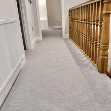View of a landing fitted with pale grey 80% wool 20% nylon twist carpet with 2 x ply yarn, moth proofed wool yarn with very heavy domestic rating.