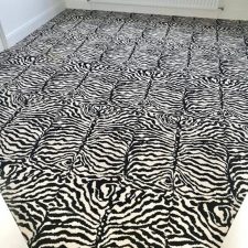 View of a floor fitted with a zebra patterned woven Axminster carpet made of 80% wool 20% nylon.