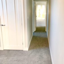 View of a bedroom fitted with a grey polypropylene twist carpet which is bleach cleanable in one tenth gauge, 2 x ply yarn