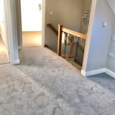 View of an upstairs landing fitted with a grey polypropylene twist carpet which is bleach cleanable in one tenth gauge, 2 x ply yarn