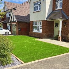 Front garden fitted with an artificial lawn which is a blend of polyethylene and polypropylene, with 4 colours blended. The lawn is bright green and is UV resistant.