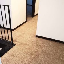 A landing fitted with a beige domestic polypropylene twist pile carpet.