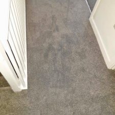 View of a landing fitted with grey Polypropylene, bleach cleanable twist pile carpet.