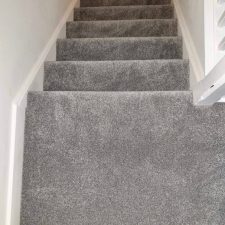 View down stairs fitted with grey Polypropylene, bleach cleanable twist pile carpet.