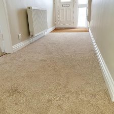 Beige polypropylene Saxony carpet fitted in a hallway