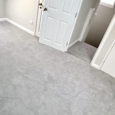 View of an upstairs landing fitted with grey polypropylene twist pile carpet.
