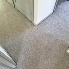 View of a landing fitted with a wool berber twist, moth resistant grey carpet.