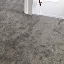 A grey landing fitted with a polypropylene twist, bleach cleanable carpet.