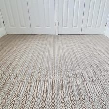 Bedroom carpet with herringbone design in neutral colours