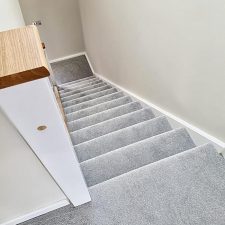 View down stairs fitted with a grey 100% polypropylene heather twist bleach cleanable carpet.