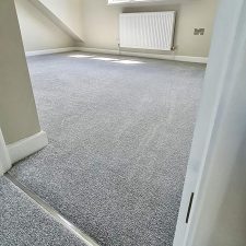 View into a loft room fitted with a grey 100% polypropylene heather twist bleach cleanable carpet.