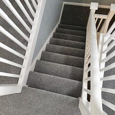 View down a fitted stair carpet in grey Polypropylene pile.