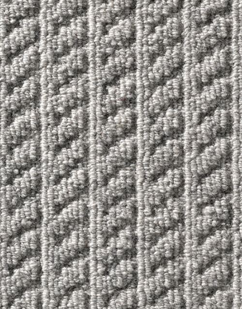 Closeup of the Rustik patterned carpet in grey by Ulster Carpets