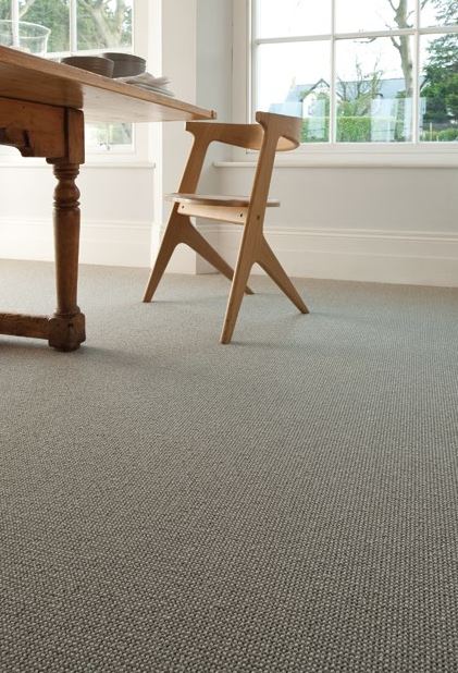 A dining room carpet fitted with the Queenstown pattern.