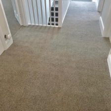 An upstairs landing fitted with a neutral Wool mix berber twist, extra heavy domestic carpet.