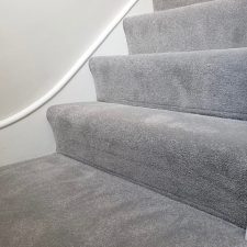 An view of some stairs fitted with a grey polypropylene bleach cleanable, fade resistant domestic carpet.